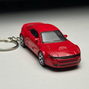 May include: A set of three ceramic mugs with a speckled, matte finish. The mugs are in shades of cream, light gray, and dark gray. Each mug has a simple, minimalist design, perfect for coffee or tea.