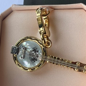 Pulsera con dije BANJO de Juicy Couture, novedad rara