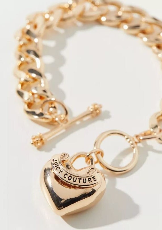 Buy the Designer Juicy Couture Gold-Tone Puffy Heart Dangle Toggle Charm  Bracelet | GoodwillFinds