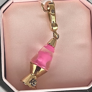 ¡Nuevo artículo raro! Pulsera con dije de lámpara de lava rosa de Juicy Couture