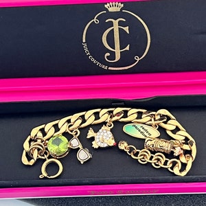 PULSERA SURF DE ORO CON DIJES MÚLTIPLES DE JUICY COUTURE (120GMCB)