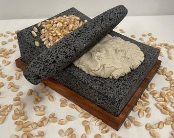 Beautiful Metate handmade with volcanic stone with parota Wood base