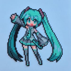 May include: Pixel art of a female anime character with long, turquoise pigtails. The character is wearing a black and gray outfit with pink accents. The artwork is made from small, colorful beads.