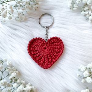 Crochet hearts. Hang them on gifts, make keychains. Use as washable and reusable face scrubbies. Make a garland, use as car charms, bag charm. The perfect and quick handmade valentine gift.  Heart, love, elegant, classic, simple design. Animo design