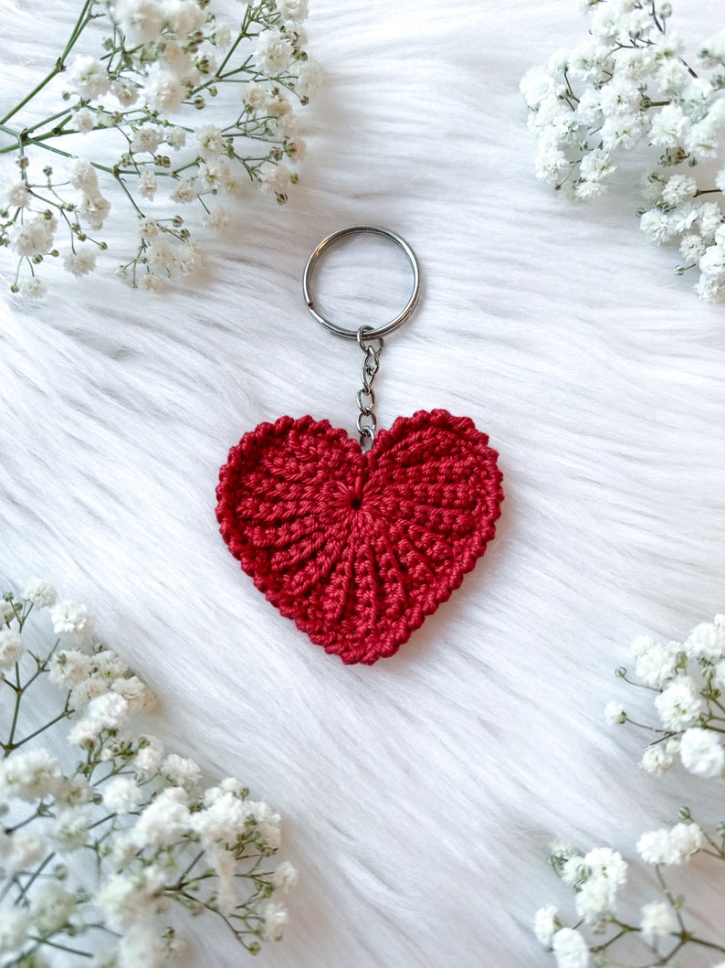 Crochet hearts. Hang them on gifts, make keychains. Use as washable and reusable face scrubbies. Make a garland, use as car charms, bag charm. The perfect and quick handmade valentine gift.  Heart, love, elegant, classic, simple design. Animo design