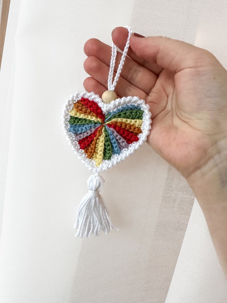 Crochet hearts. Hang them on gifts, make keychains. Use as washable and reusable face scrubbies. Make a garland, use as car charms, bag charm. The perfect and quick handmade valentine gift. Pride heart, crochet pride, pride gift, love. Animo design