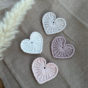 Crochet hearts. Hang them on gifts, make keychains. Use as washable and reusable face scrubbies. Make a garland, use as car charms, bag charm. The perfect and quick handmade valentine gift. Love. Heart, elegant, classic, simple design. Animo design