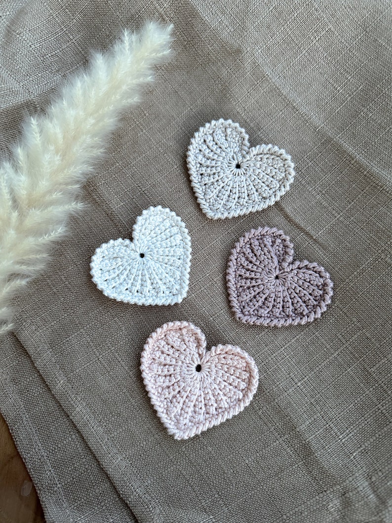 Crochet hearts. Hang them on gifts, make keychains. Use as washable and reusable face scrubbies. Make a garland, use as car charms, bag charm. The perfect and quick handmade valentine gift. Love. Heart, elegant, classic, simple design. Animo design