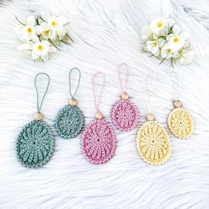 Crochet beautiful egg decorations in two sizes! Use them to decorate your Easter tree, Easter eggs, Easter table settings, windows, or why not hang them on a bottle? Crochet eggs, Ester decor, virkade påskägg, påskris. Animo design