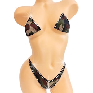 May include: A camouflage-patterned bikini with black trim and rhinestones. The bikini top and bottom are both triangle shaped.
