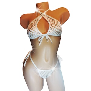May include: White mesh bikini set with a halter top and a thong bottom. The bikini is decorated with rhinestones.