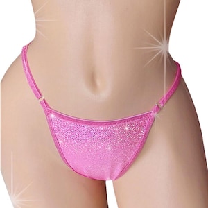 May include: Pink sparkly bikini bottom with adjustable straps.