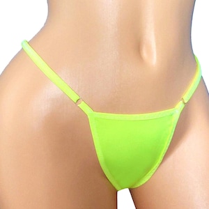 Tanga ajustable: brilla en colores de luz negra, ideal para fiestas rave.