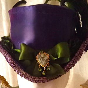 Victorian/ Steampunk Style Ladies Top Hat  in Purple Satin w/ Green Accents & Cameo Brooch