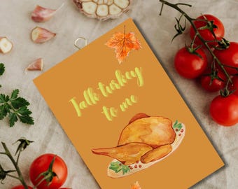 May include: An orange card with the text "Talk turkey to me" and a watercolour illustration of a roasted turkey on a plate. Garnished with a sprig of parsley, garlic cloves, and red tomatoes.