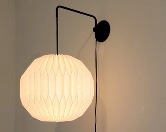 Industrial black metal sconce with round paper lampshade, modern pleate wall light, bedside sconce, round sconce, swing arm wall lamp.