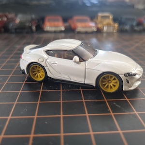 2023 Toyota GR Supra Toy by Matchbox, Customized With Gold 10 Spoke Alloy Wheels and Real Rider Rubber TIres