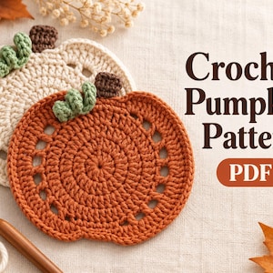 May include: Two crocheted pumpkin coasters, one in burnt orange and one in cream, each featuring a green stem and brown top detail. The text Crochet Pumpkin Pattern PDF is displayed in dark brown lettering on the right side of the image.