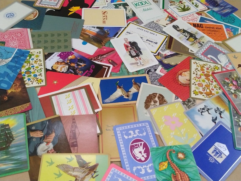 a large amount of different vintage playing cards