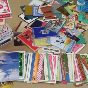 a large amount of different vintage playing cards