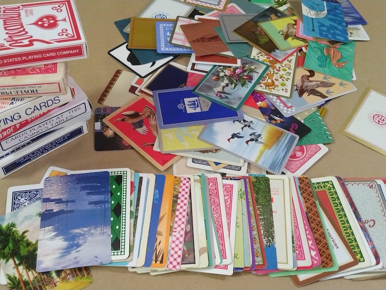 a large amount of different vintage playing cards
