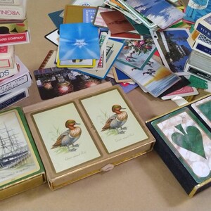 a large amount of different vintage playing cards