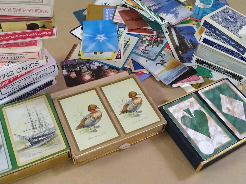 a large amount of different vintage playing cards