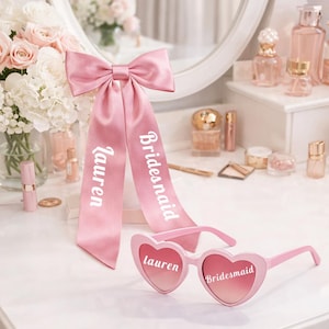 May include: A set of three ceramic mugs with a speckled, matte finish. The mugs are in shades of cream, light gray, and dark gray. Each mug has a simple, minimalist design, perfect for coffee or tea.