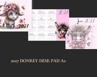 Puede incluir: Un bloc de notas de escritorio de 2027 con una linda ilustración de burro y detalles florales. El calendario tiene un fondo rosa y diseños mensuales. El burro está adornado con flores y mariposas, con la palabra "Calendario" en la parte superior.