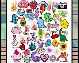 May include: A collection of colorful iron-on patches featuring various designs, including animals, food, plants, and text. The patches are perfect for adding a personal touch to clothing, bags, and other accessories.
