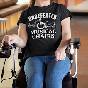 Disability wheelchair shirt, Undefeated musical chairs funny, funny disability tshirt, funny disability t-shirt, funny disability