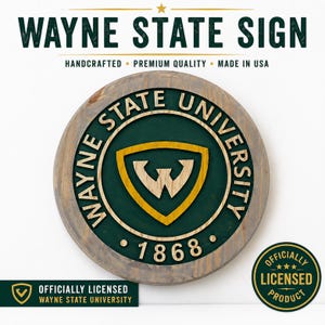 May include: A round wooden sign with the text "WAYNE STATE SIGN" at the top. The sign features the Wayne State University logo in green and gold, with the year 1868. The sign is officially licensed and handcrafted in the USA.