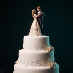 May include: A three-tiered white wedding cake decorated with piped icing swags and small beige roses. Atop the cake sits a figurine of two figures in formal attire, a person in a long white gown and a person in a dark suit, dancing together.