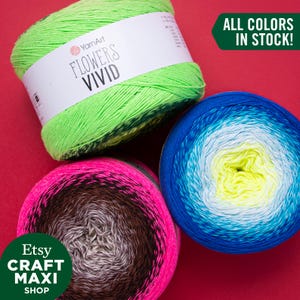 May include: Three skeins of yarn in different color combinations. The skeins are labeled "YarnArt Flowers Vivid" and "Etsy Craft Maxi Shop". The text "ALL COLORS IN STOCK!" is displayed in green.