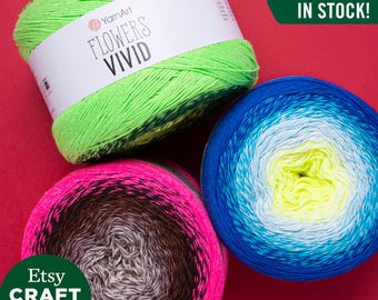 May include: Three skeins of yarn in different color combinations. The skeins are labeled "YarnArt Flowers Vivid" and "Etsy Craft Maxi Shop". The text "ALL COLORS IN STOCK!" is displayed in green.