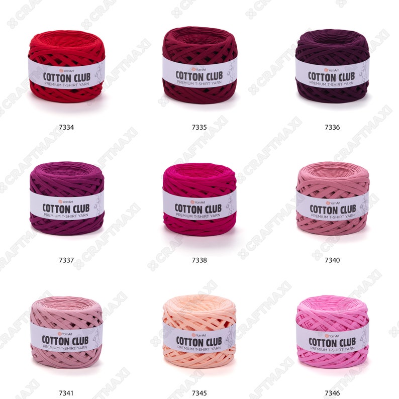 May include: Nine balls of yarn in various shades of pink and red. The yarn is made of cotton and is labeled "Cotton Club Premium T-Shirt Yarn".