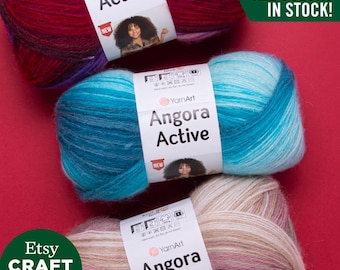Könnte beinhalten: Drei Knäuel Garn in verschiedenen Farbkombinationen. Das Garn ist mit "Angora Active" gekennzeichnet und in allen Farben erhältlich. Das Garn ist auf Etsy erhältlich.