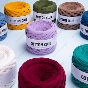 May include: Assortment of colorful cotton yarn balls, each with a white label that reads "YarnArt Cotton Club Premium T-Shirt Yarn".