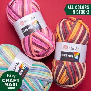 May include: Three balls of colourful striped yarn labelled "YarnArt Cord Yarn VR". The yarn is made of soft, stretchy fabric and is available in a variety of colours. All colours are in stock.