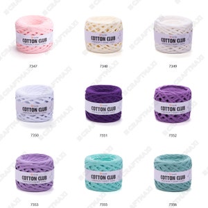 May include: Assortment of ten balls of cotton yarn in various colors, including pink, white, light blue, purple, lavender, and teal. Each ball has a label that reads "Cotton Club Premium T-Shirt Yarn".