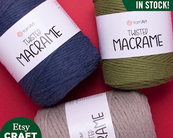 May include: Three spools of twisted macrame cord in blue, green, and gray. The spools are labeled "YarnArt Twisted Macrame" and "All Colors In Stock!"