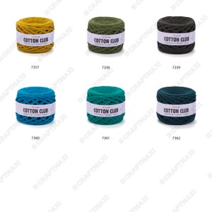 May include: Six spools of Cotton Club premium t-shirt yarn in various colors: mustard yellow, olive green, dark green, teal blue, dark teal green, and dark forest green.