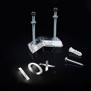 May include: A pack of 10 clear plastic corner brackets with screws and wall anchors. The brackets are designed to support shelves or other objects.