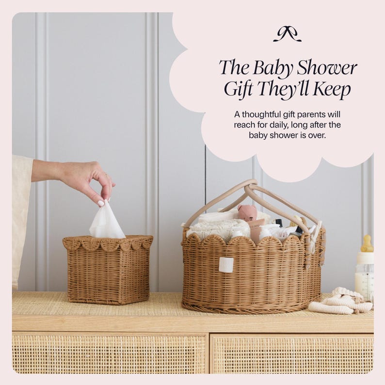 May include: A woven wicker tissue box and a matching basket filled with baby items sit on a wooden surface. The basket has a handle and contains a stuffed animal and other baby essentials. Text reads "The Baby Shower Gift They'll Keep."
