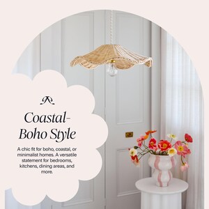 May include: A woven rattan pendant light with a scalloped edge hangs from the ceiling. The light fixture is above a white table with a vase of colorful flowers. The text reads "Coastal- Boho Style".
