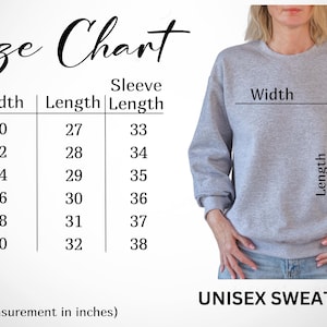 May include: A light gray unisex sweatshirt with a size chart showing measurements in inches. The chart lists sizes S to 3XL, with widths from 20 to 30 inches and lengths from 27 to 32 inches. The sleeve lengths range from 33 to 38 inches.