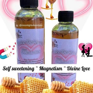 May include: Two glass bottles of "Dulce De Honey" spiritual bath with black caps and white labels. The labels have pink heart designs and text. Honeycombs and honey dippers are in the foreground. Text includes "Self sweetening ~ Magnetism ~ Divine Love".
