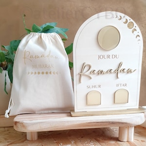 Wooden Ramadan calendar with golden arches, Ramadan day counter, Iftar and Suhur times, and stand.