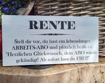 May include: A white wooden sign with black text that reads "RENTE" and a humorous message about retirement. The text reads: "Stell dir vor, du hast ein lebenslanges ARBEITS-ABO und plötzlich heißt es: "Herzlichen Glückwunsch, dein ABO wurde gekündigt! Ab sofort hast du FREI!"