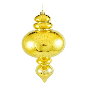 May include: A gold glass Christmas bauble with a teardrop shape and a textured surface.